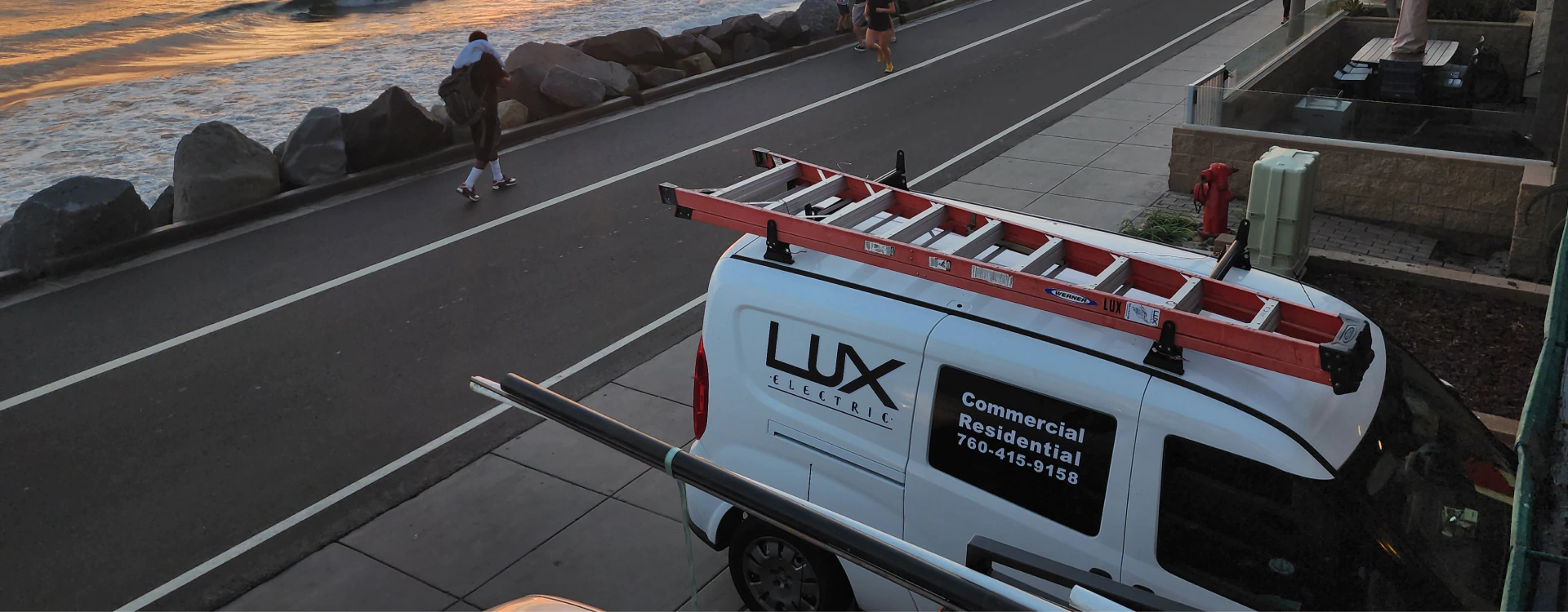 a view of the company van parked near the coastline